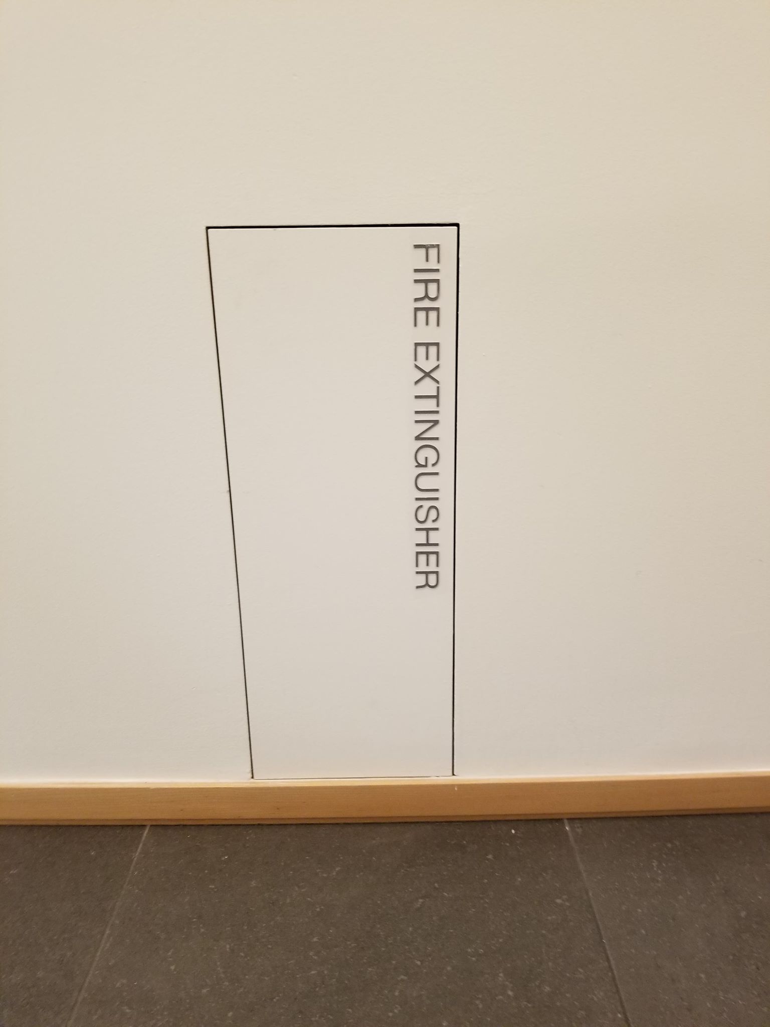 Detail of fire hydrant placed along the bottom of the wall