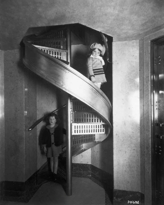 Children on a winding staircase at the Chateau Laurier Hotel. Ottawa, Ont, Can. ca. 1931