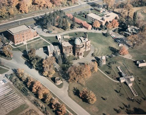 Coloured photograph of Dominion Observatory from aerial view.